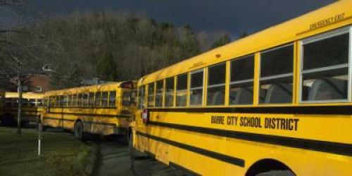 school buses lined up outside the school
