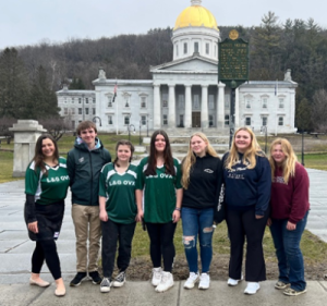 Thrives' Youth Engagement Specialist, Kayla Jager (left), with Leland & Gray High School Our Voices Exposed (OVX) student members after speaking to legislators at Prevention Day 2023.