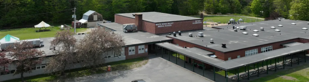 An aerial image of a Vermont school in the mountains